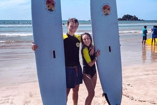 PRIVATE Surf lesson for Beginners Couple - Entering Weligama Beach and catching waves