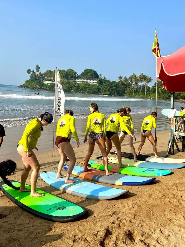 Surf School in Unawatuna, Galle - Taking the board into the waves
